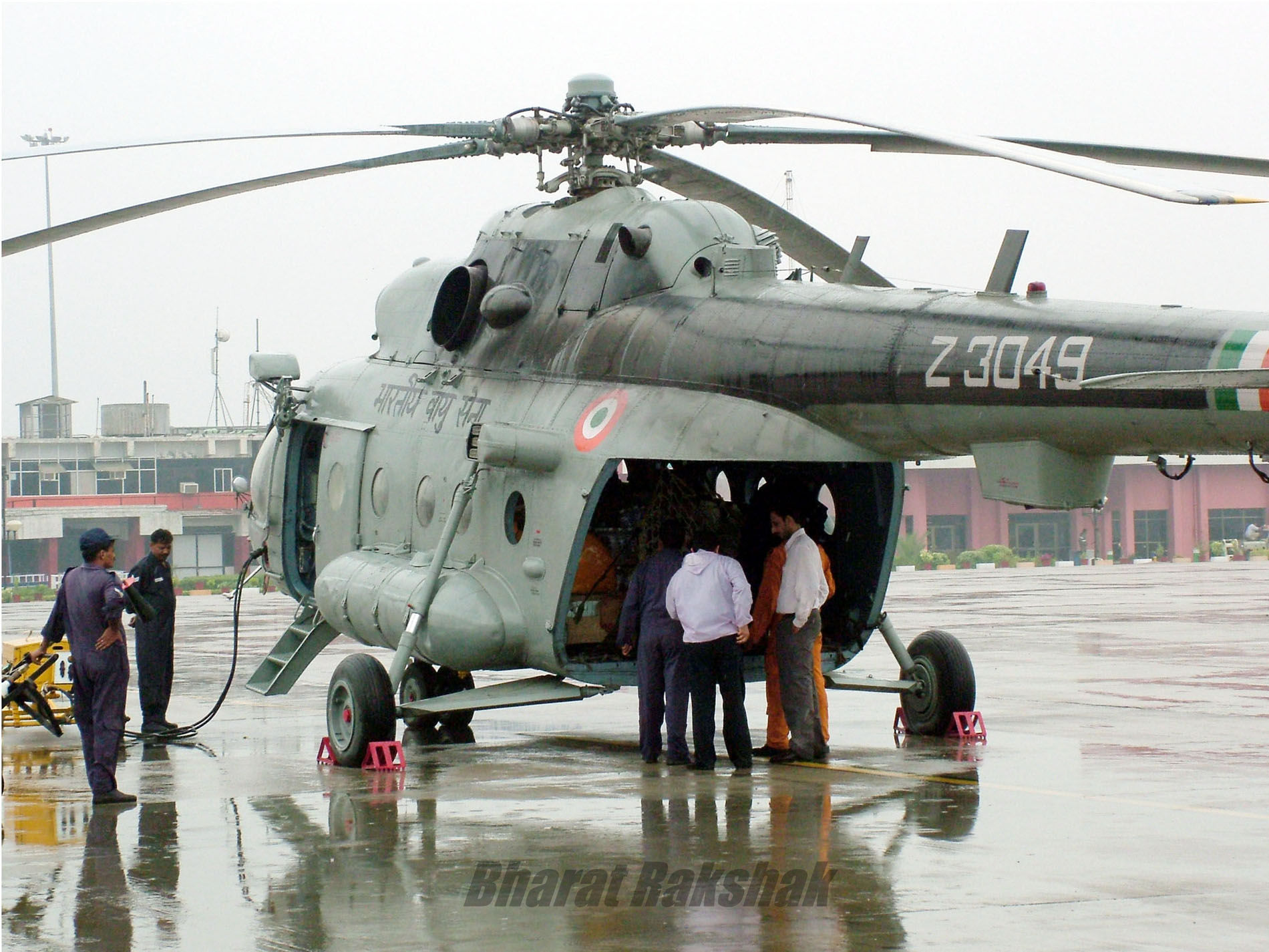 IAF personnel loading relief materials for the flood-affected people in Gujarat on July 3, 2005.