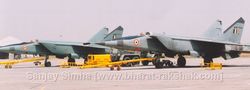 Two MiG-25s  being maintained